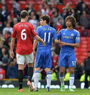 Manchester United v Chelsea 5th May 2013 Collection: Clash at Old Trafford: Oscar and Ake Face-Off Against Evans After Manchester United vs
