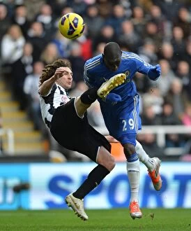 Newcastle United v Chelsea 2nd February 2013 Collection: Clash at St. James Park: Demba Ba vs. Coloccini - A Rough Premier League Encounter between