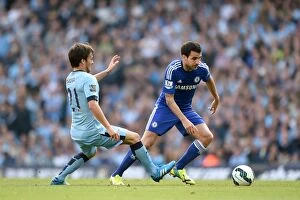 Images Dated 21st September 2014: Clash of the Titans: Fabregas vs. Silva - Manchester City vs