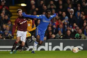 Images Dated 21st February 2013: Clash of Titans: Victor Moses vs. Matej Hybš in the UEFA Europa League Round of 16 Showdown at