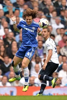 Tottenham Hotspur v Chelsea 28th September 2013 Collection: David Luiz vs. Roberto Soldado: A Battle for Ball Possession - Tottenham Hotspur vs
