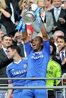 FA Cup Final versus Portsmouth May 2010 Collection: Didier Drogba's FA Cup Triumph: Chelsea's Victory Celebration (2010) - vs. Portsmouth