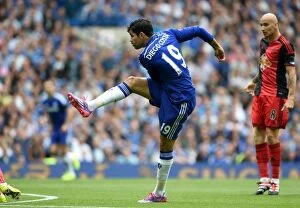 Images Dated 13th September 2014: Diego Costa's Thrilling Shot at Glory: Chelsea vs Swansea City, Barclays Premier League