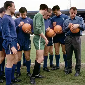 Footballers of Chelsea's Division One Team Signing Footballs Before FA Cup Final: Ron Harris, John Boyle, Peter Bonetti, Alan Harris, and Tommy Docherty