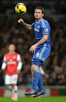 Frank Lampard Soaring High: Heading the Ball Against Arsenal in the Premier League Rivalry (December 23, 2013)