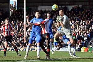 Brentford v Chelsea FA Cup 27th January 2013 Collection: Frank Lampard's Shot Defied by Brentford Goalkeeper Moore in FA Cup Clash (January 2013)