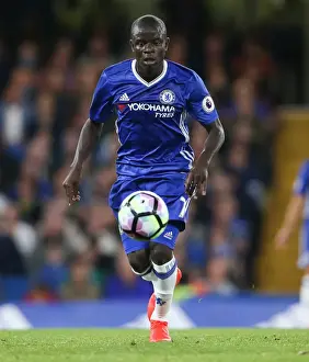 Golo Kante vs. Liverpool: Intense Face-Off at Stamford Bridge during Chelsea's Premier League Clash