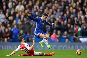Home Prints: Hazard's Leap Over Mustafi: Intense Rivalry in Chelsea vs Arsenal Premier League Showdown