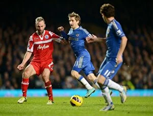 Images Dated 2nd January 2013: Intense Battle for the Ball: Marko Marin vs. Shaun Derry at Stamford Bridge (January 2nd, 2013)