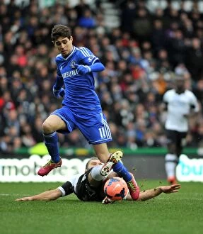 Derby County v Chelsea 5th January 2014 Collection: Intense Battle for the Ball: Oscar vs. Buxton - FA Cup Third Round, iPro Stadium (January 2014)