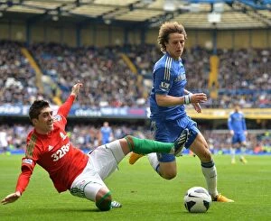 Images Dated 28th April 2013: Intense Battle for Ball Possession: David Luiz vs. Pablo Hernandez - Chelsea FC vs