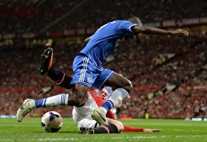 Images Dated 26th August 2013: Intense Battle for Ball Possession: Ramires vs. Rooney - Manchester United vs
