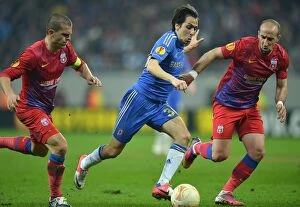 Images Dated 7th March 2013: Intense Battle for Ball Possession: Steaua Bucharest vs. Chelsea