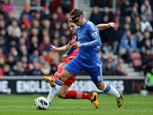 Southampton v Chelsea 30th March 2013 Collection: Intense Battle: Fernando Torres vs. Jos Hooiveld - Southampton vs