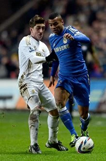 Images Dated 23rd January 2013: Intense Rivalry: Ashley Cole vs. Pablo Hernandez - Chelsea's Capital One Cup Semi-Final Showdown