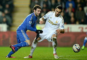 Intense Rivalry: Juan Mata vs. Chico - Battle for Ball in Chelsea vs. Swansea Capital One Cup Semi-Final