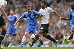 Images Dated 28th September 2013: Intense Rivalry: Juan Mata vs. Mousa Dembele - A Battle for Supremacy in the Premier League Clash