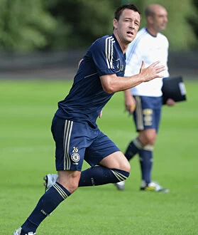 Training Pictures Collection: John Terry in Action: Chelsea FC Training Session at Cobham, August 2012