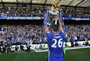 Images Dated 21st May 2017: John Terry Lifts the Premier League Trophy: Chelsea's Triumph at Stamford Bridge