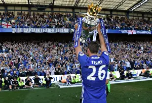John Terry Lifts the Premier League Trophy: Chelsea's Triumph at Stamford Bridge