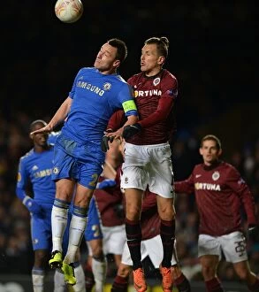 Images Dated 21st February 2013: John Terry vs. Ondrej Svejdik: A Battle for the Ball in Chelsea's UEFA Europa League Clash against