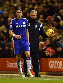 Liverpool v Chelsea 20th January 2015 Collection: Jose Mourinho's Unwavering Focus: Chelsea Manager Holds the Ball Amidst the Intense Semi-Final