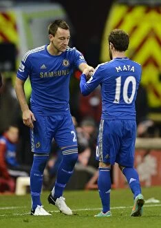 Images Dated 12th January 2013: Juan Mata Transfers Chelsea Captain Armband to John Terry During Substitution at Stoke City