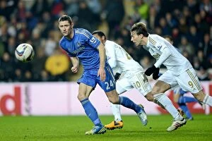 Images Dated 23rd January 2013: Miguel Michu and Jonathan de Guzman vs. Gary Cahill: A Tactical Battle in the Swansea City vs