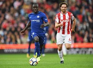 Images Dated 23rd September 2017: N'Golo Kante vs Joe Allen: Intense Midfield Battle at Stoke City vs Chelsea, Premier League